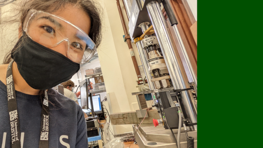Photograph of Aree in the lab doing a mechanical test